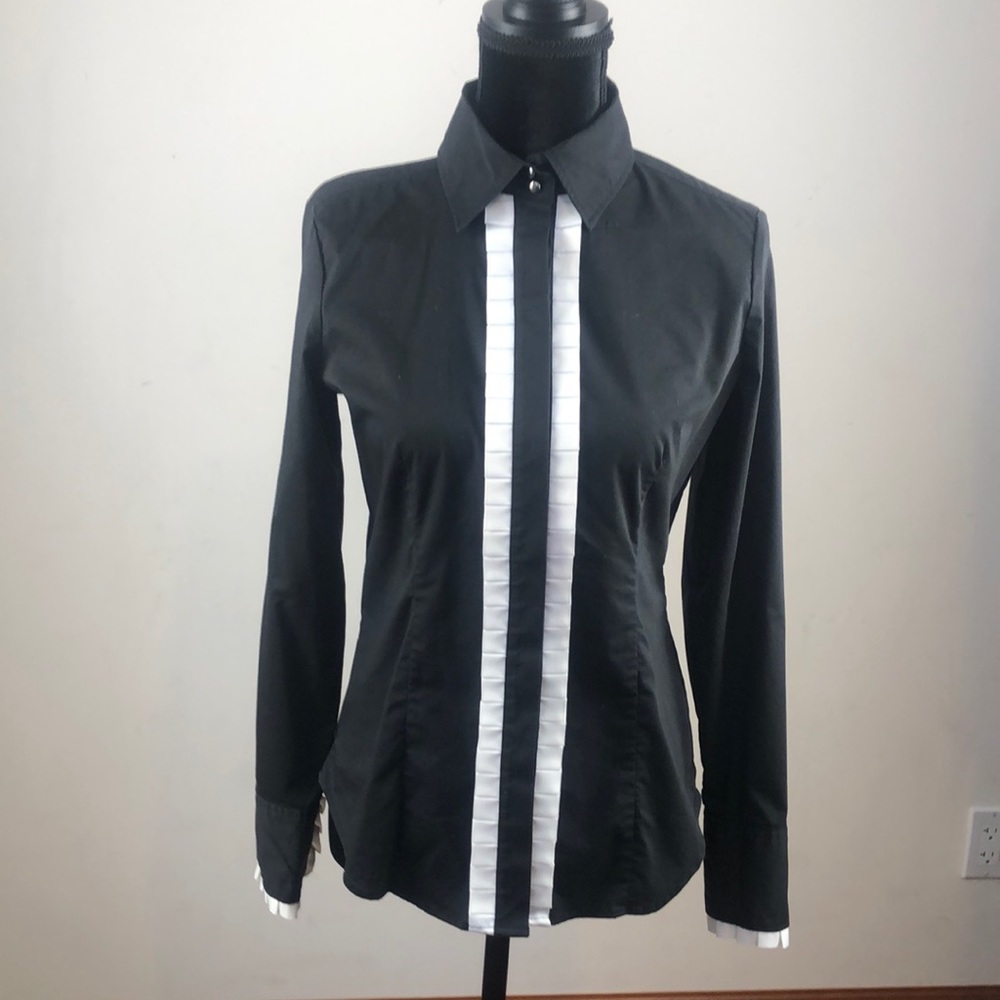New York & Company black button down blouse with white ruffles down front.